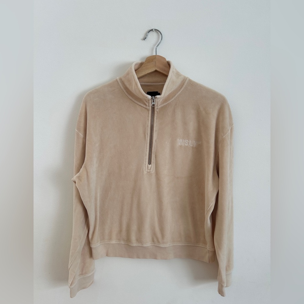 Cream quarter-zip sweatshirt